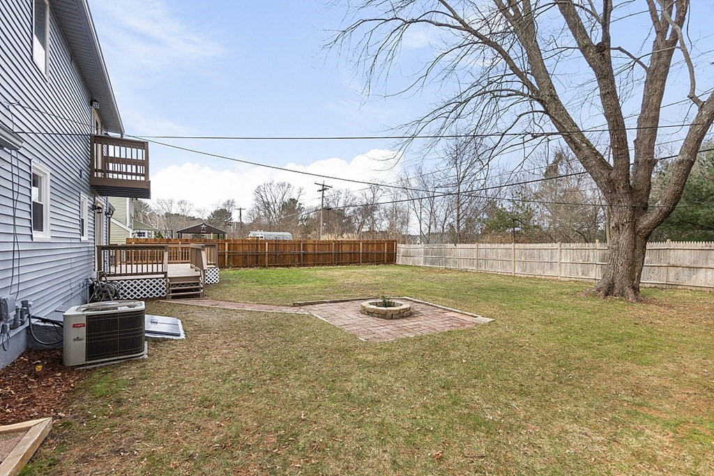 32 Elaine Street Webster, MA 01570 - Photo 7 of 42 a view of a backyard with wooden fence