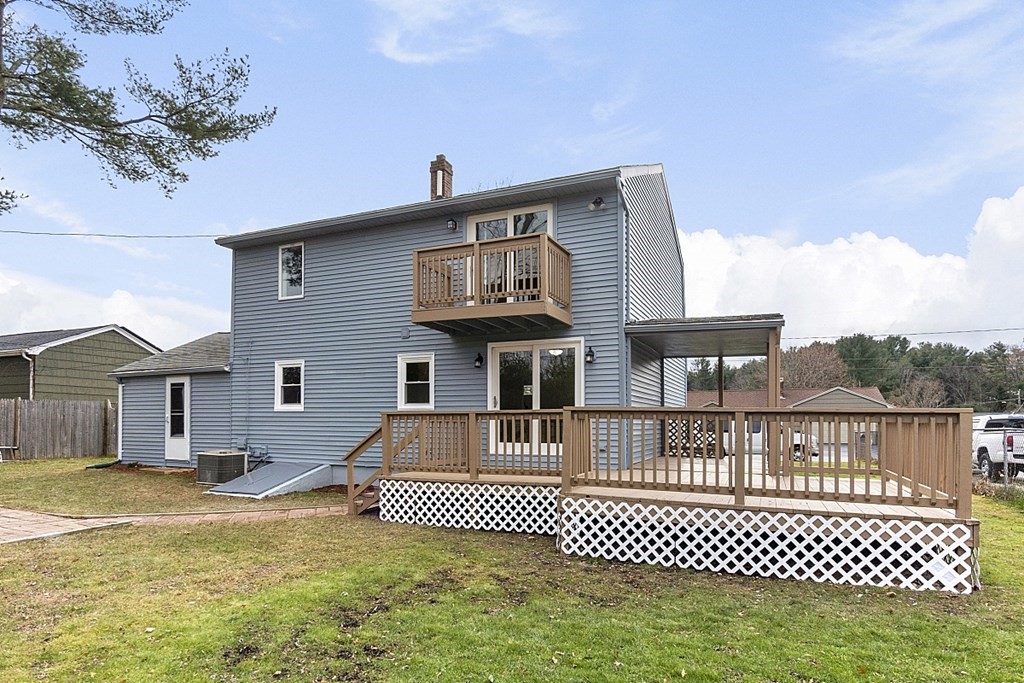32 Elaine Street Webster, MA 01570 - Photo 10 of 42 a front view of a house with a garden