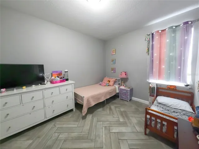 a bathroom with a sink mirror and toilet