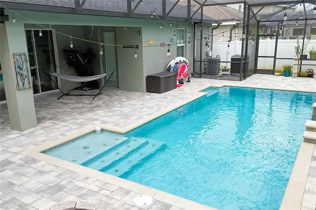 a view of a backyard with sitting area