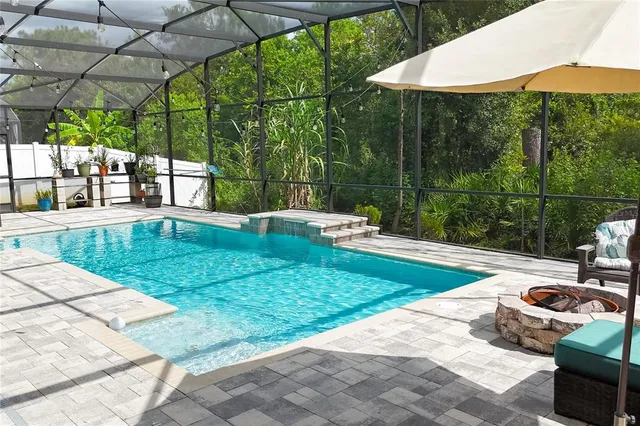 a view of a porch with furniture and a yard