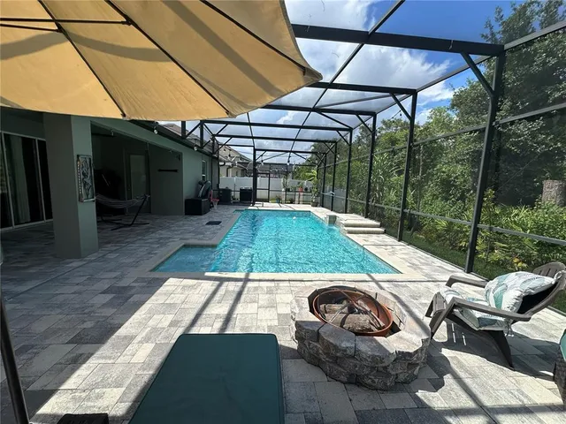 a view of backyard with large tree