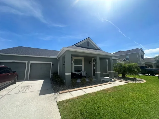 a kitchen with kitchen island a sink table and chairs
