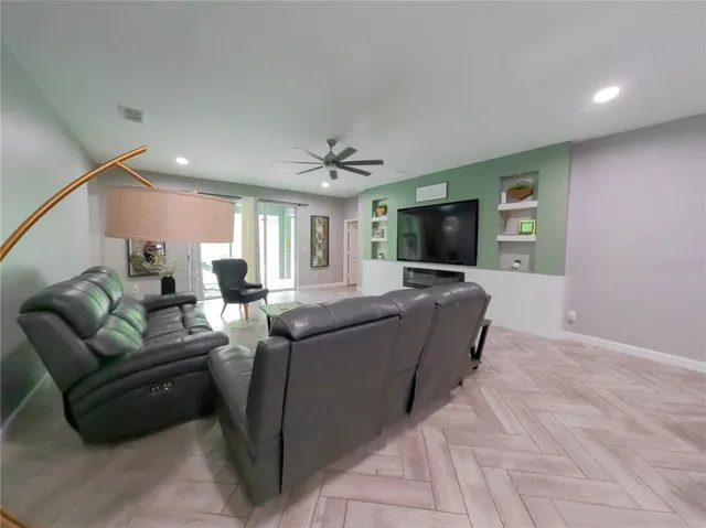 a kitchen with stainless steel appliances a refrigerator sink and microwave