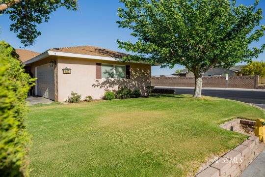 500 Scott Street Ridgecrest, CA 93555 - Photo 2 of 37 a front view of a house with garden