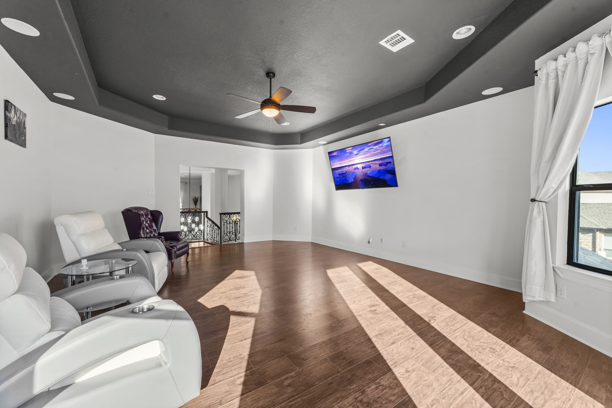 4430 Chateau Creek Way Spring, TX 77386 - Photo 23 of 46 a living room with furniture and a flat screen tv