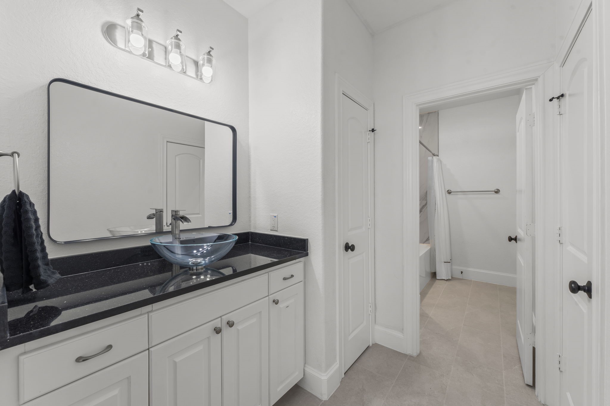 4430 Chateau Creek Way Spring, TX 77386 - Photo 25 of 46 a bathroom with a granite countertop sink and a mirror