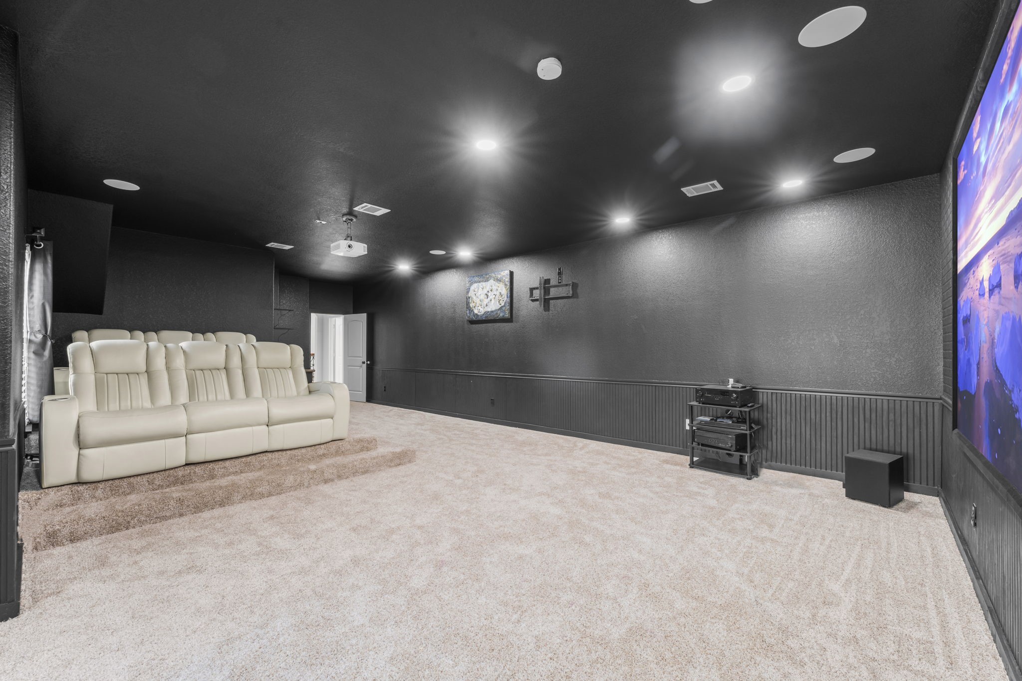 4430 Chateau Creek Way Spring, TX 77386 - Photo 30 of 46 a view of a projector room with a couch