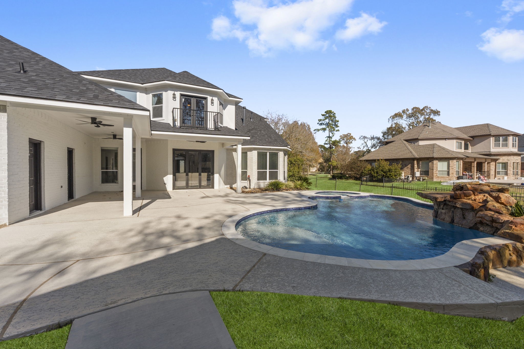 4430 Chateau Creek Way Spring, TX 77386 - Photo 38 of 46 a view of a house with a swimming pool