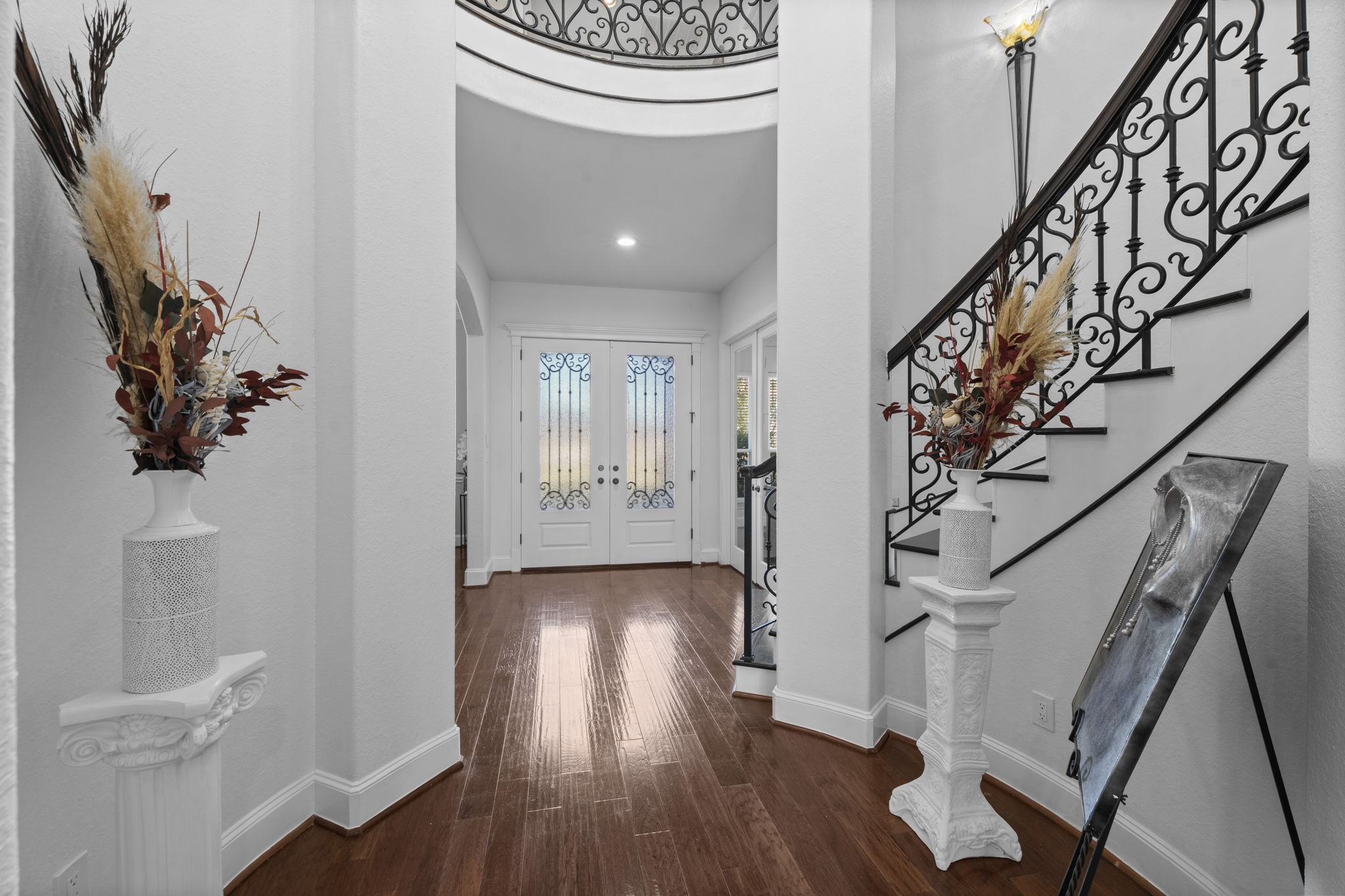 4430 Chateau Creek Way Spring, TX 77386 - Photo 4 of 46 a view of an entryway with wooden floor