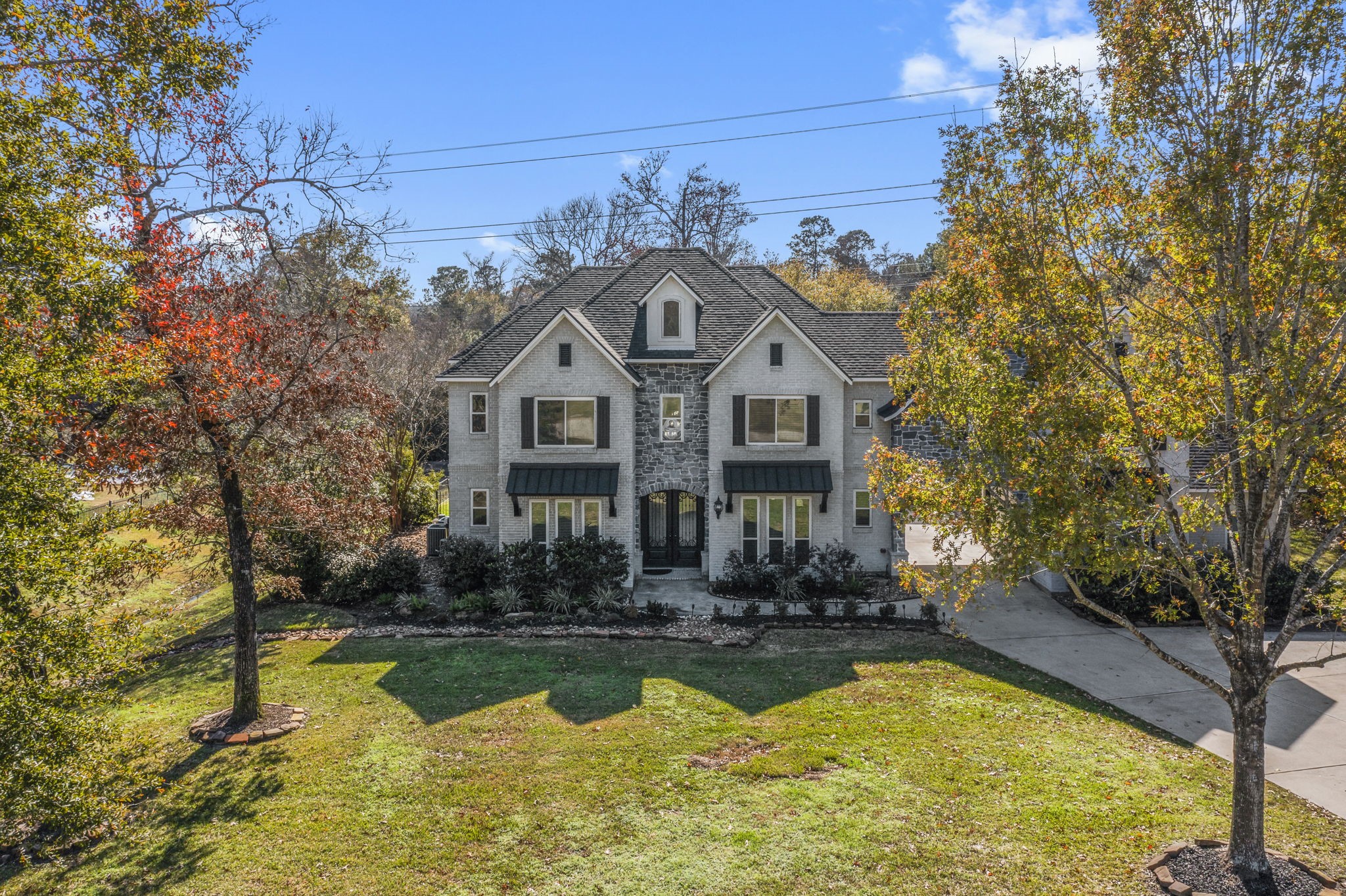 4430 Chateau Creek Way Spring, TX 77386 - Photo 44 of 46 a front view of a house with swimming pool and porch