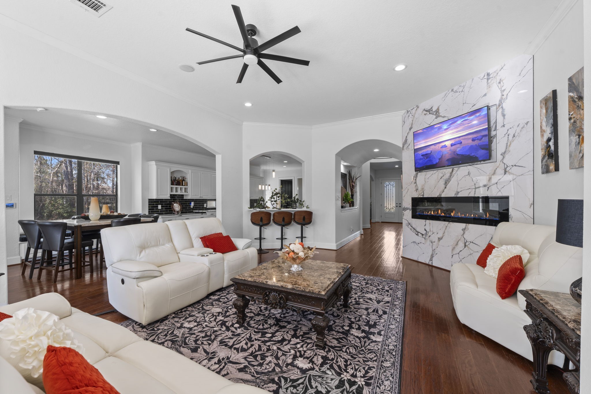 4430 Chateau Creek Way Spring, TX 77386 - Photo 8 of 46 a living room with lots of furniture and a rug