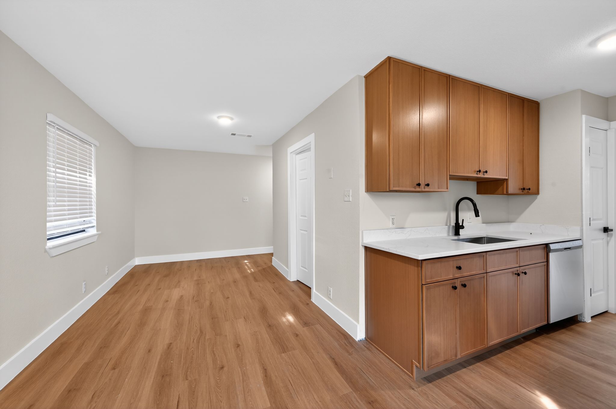 5928 Signal Point Austin, TX 78724 - Photo 12 of 14 a view of a kitchen from a sink and wooden floor