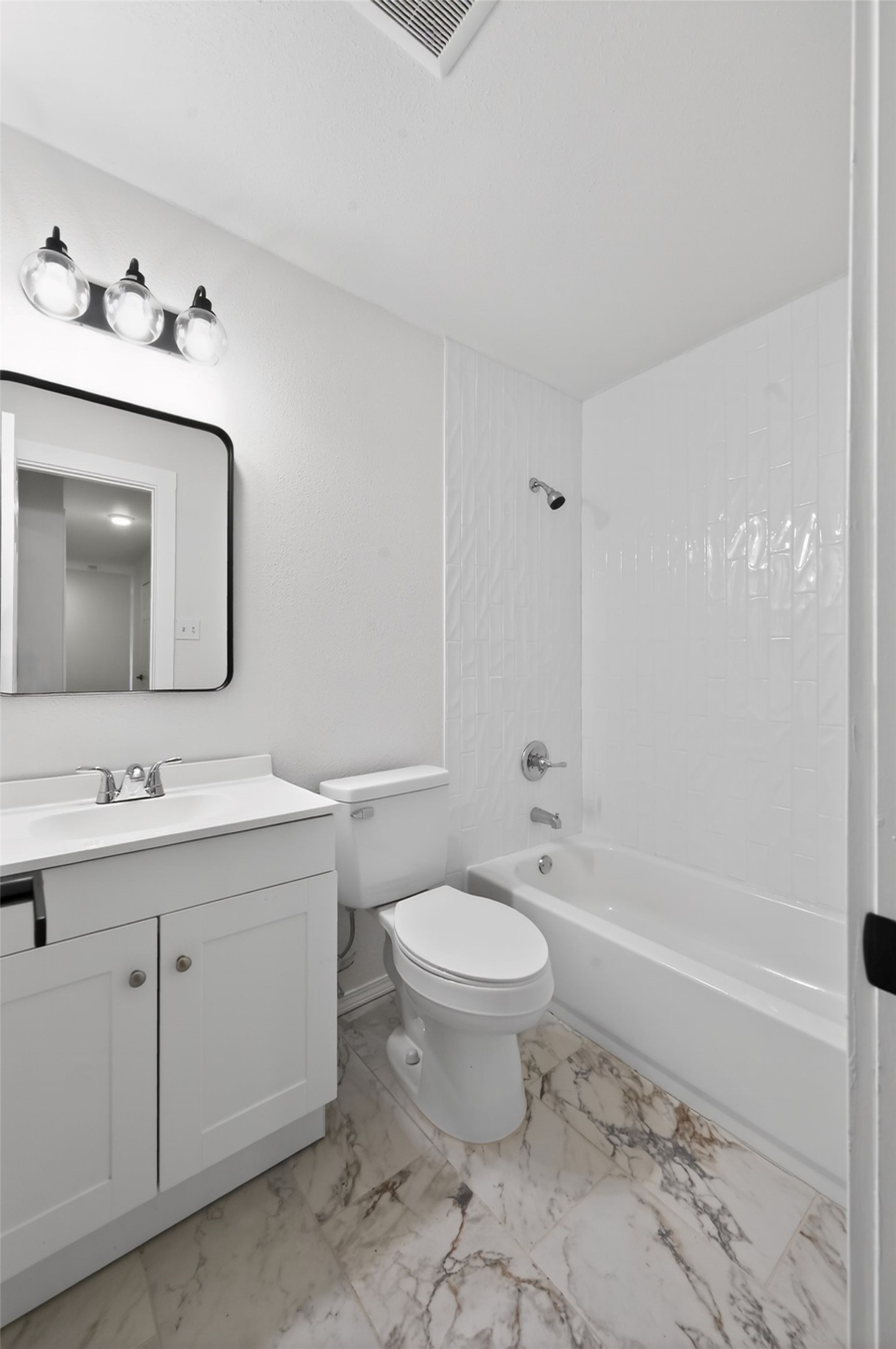 5928 Signal Point Austin, TX 78724 - Photo 8 of 14 a bathroom with a toilet sink double vanity and tub