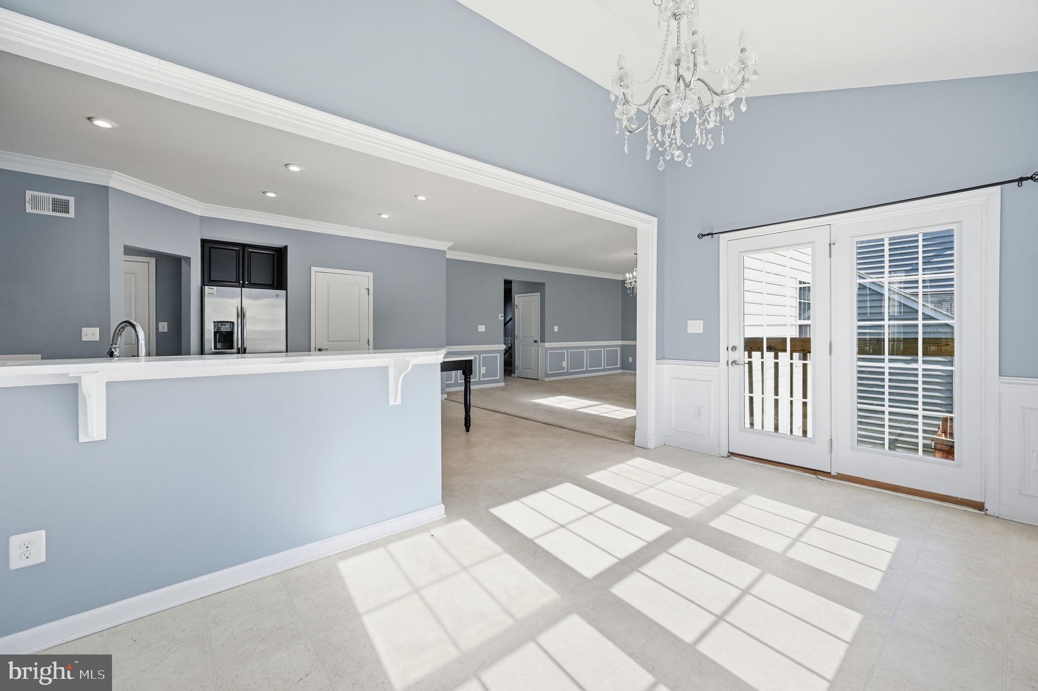 687 Blossom Tree Road Culpeper, VA 22701 - Photo 12 of 31 a view of a big room with kitchen view and windows