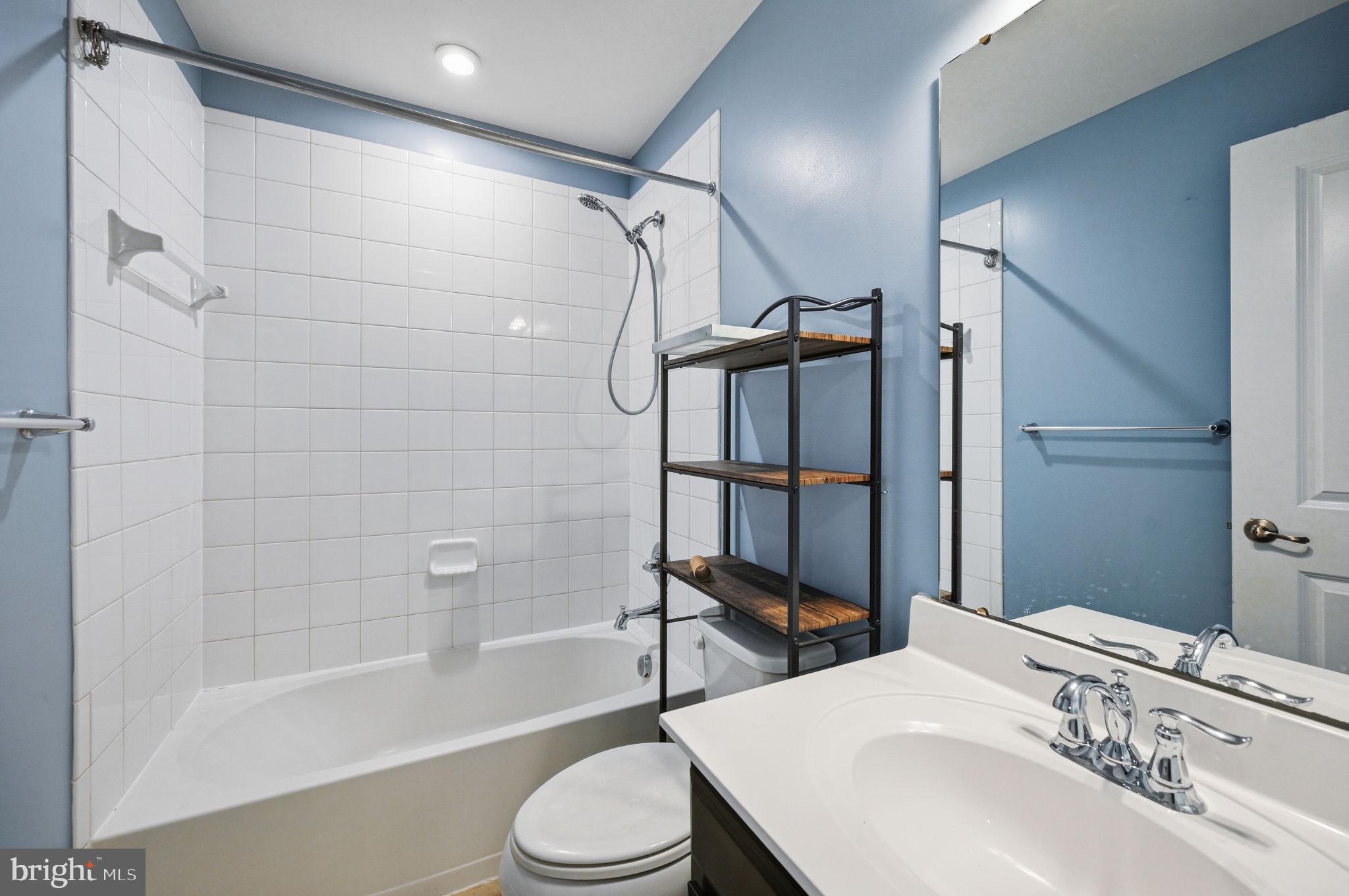 687 Blossom Tree Road Culpeper, VA 22701 - Photo 15 of 31 a bathroom with a sink toilet and shower