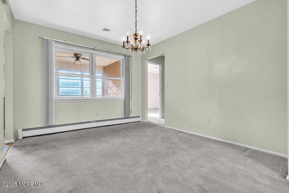 50 Oakfield Road Toms River, NJ 08757 - Photo 12 of 33 a view of an empty room with a window