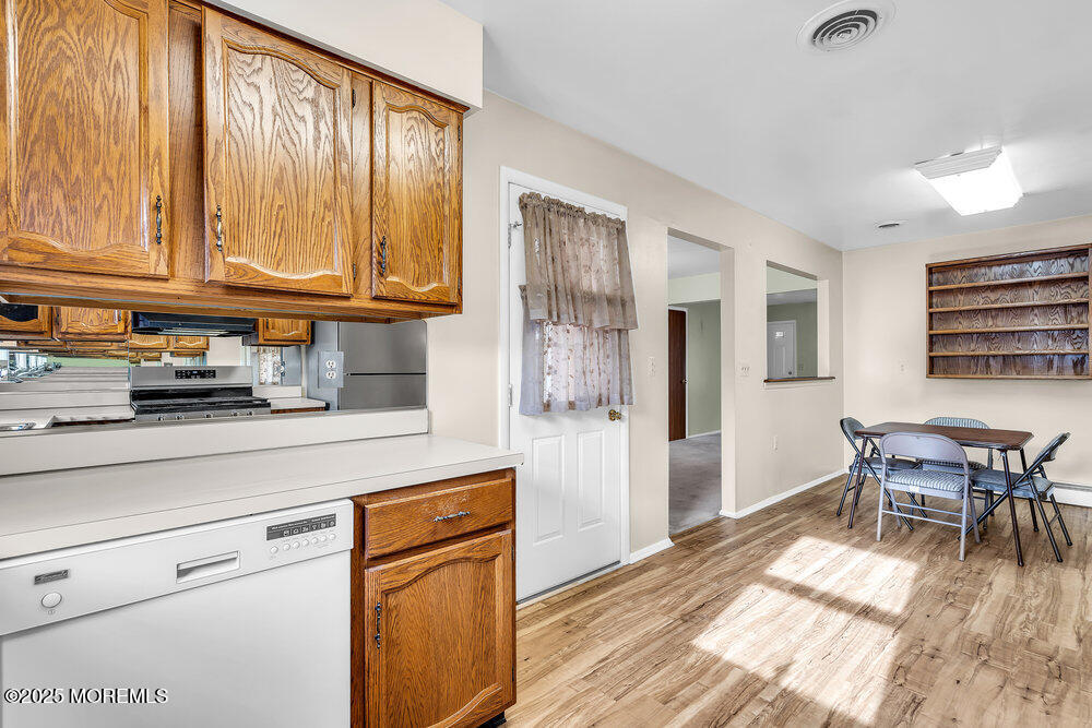 50 Oakfield Road Toms River, NJ 08757 - Photo 20 of 33 a kitchen with stainless steel appliances granite countertop a refrigerator sink and cabinets