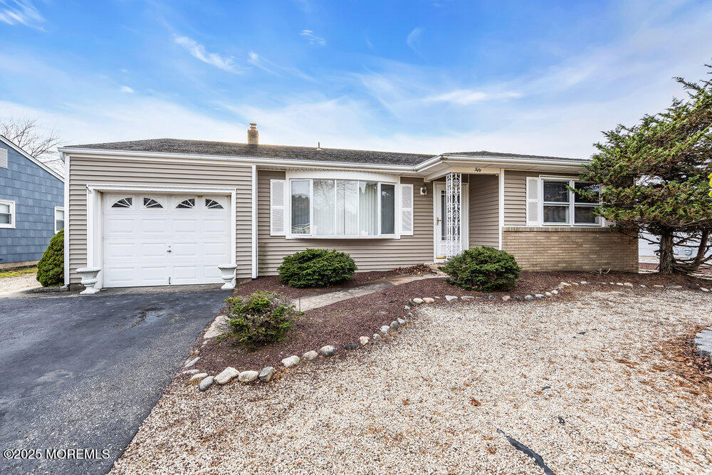 50 Oakfield Road Toms River, NJ 08757 - Photo 4 of 33 a front view of house with a yard and garage