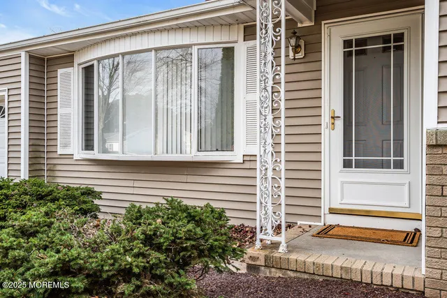 a view of house with a window and stairs