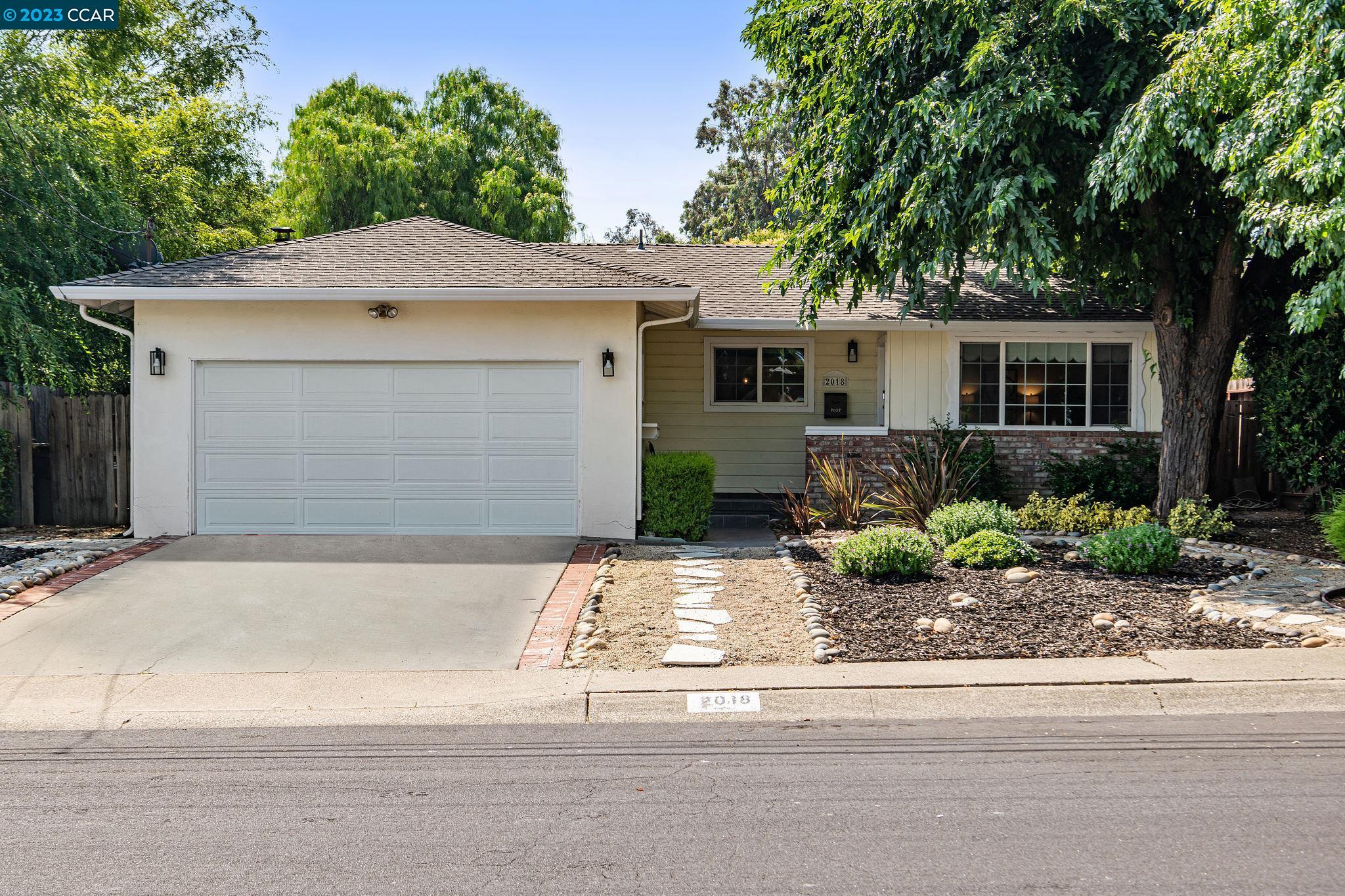 2018 Risdon Road Concord, CA 94518 - Photo 1 of 1 a front view of a house with garage and plants