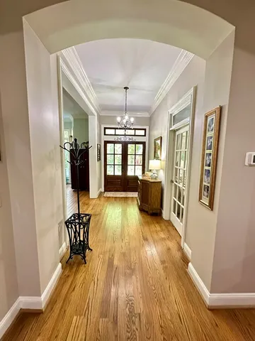a kitchen with stainless steel appliances granite countertop a stove refrigerator and a sink