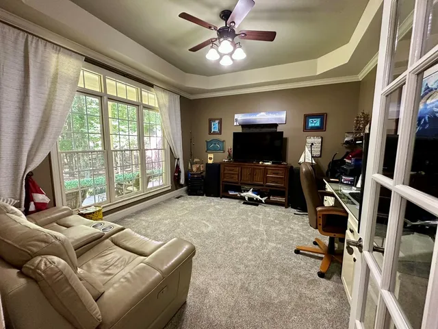 a kitchen with stainless steel appliances kitchen island granite countertop a refrigerator and a stove top oven