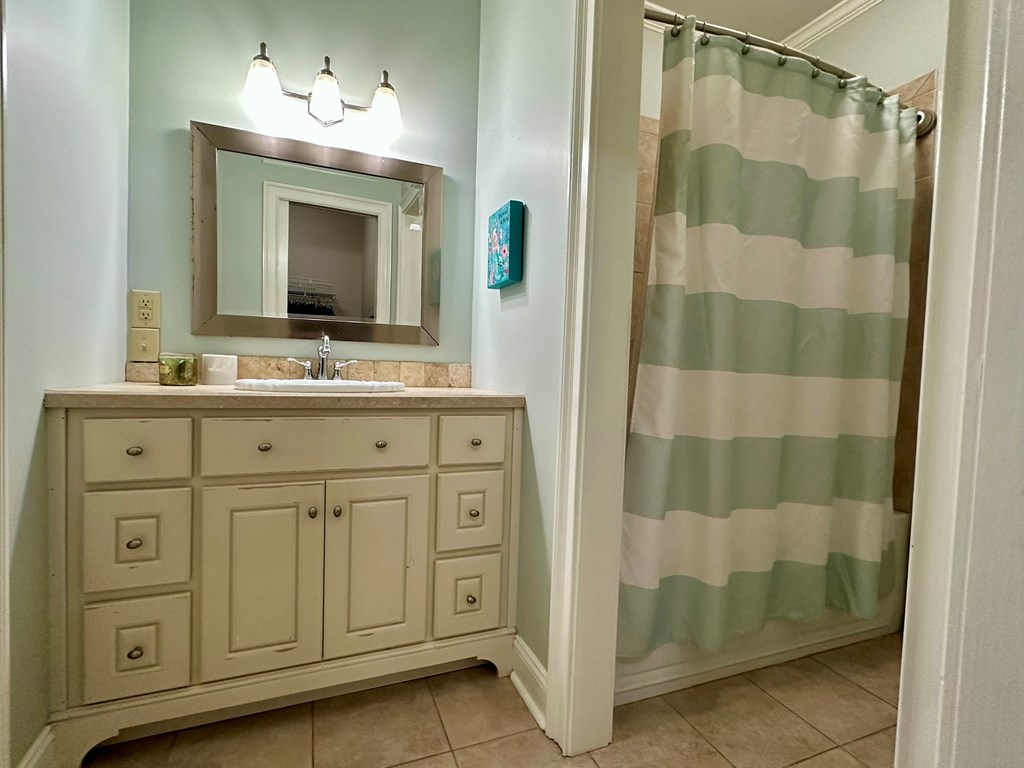 105 Lakeview Drive Hamilton, GA 31811 - Photo 48 of 63 a bathroom with a double vanity sink and a mirror