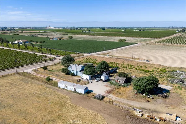 a view of swimming pool with outdoor seating and plants