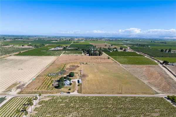 a view of a street with an ocean