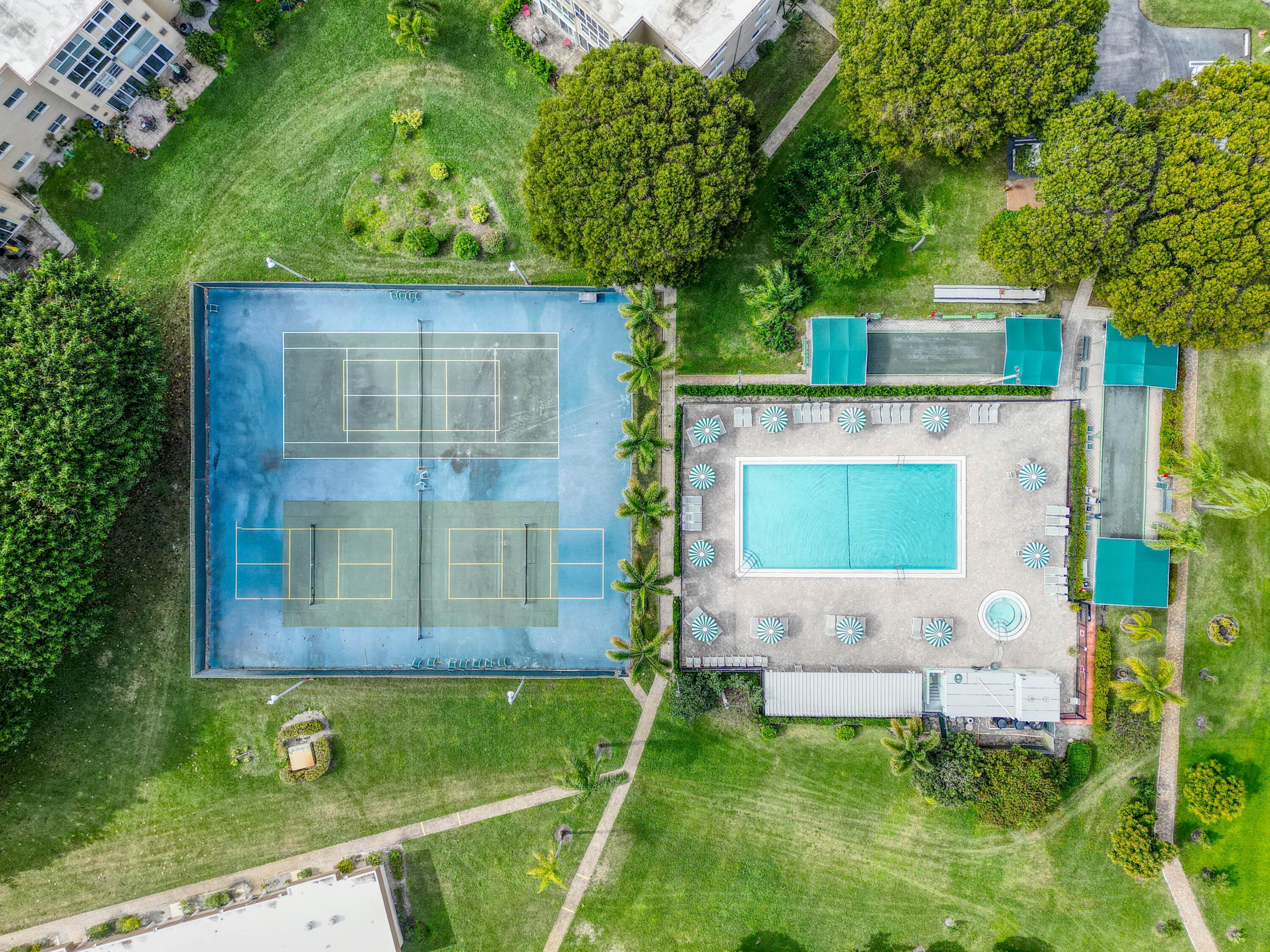 2615 Northeast 3rd Street, Unit 317 Boynton Beach, FL 33435 - Photo 26 of 38 a house view with a garden space