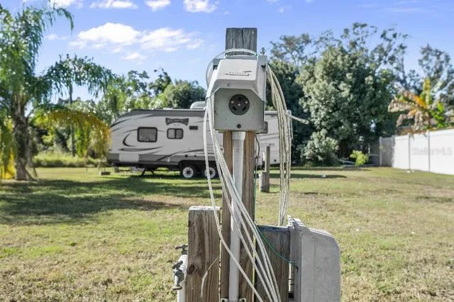 a view of a yard with a house in the background