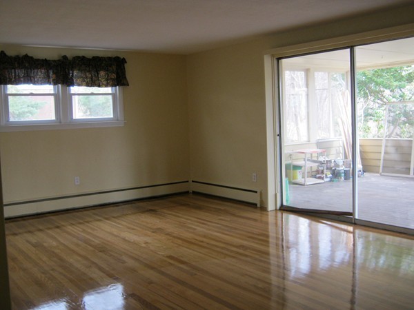 19 Rydal Street Worcester, MA 01602 - Photo 8 of 19 a view of empty room with wooden floor and fan