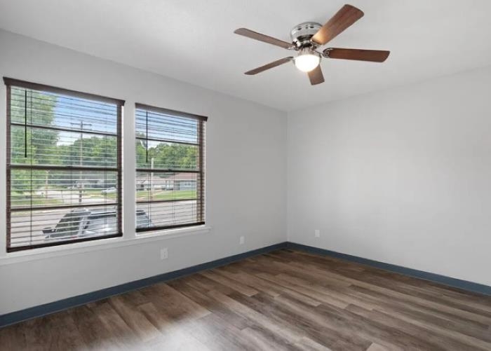 1283 East Raines Road Memphis, TN 38116 - Photo 7 of 23 an empty room with a window and a fan