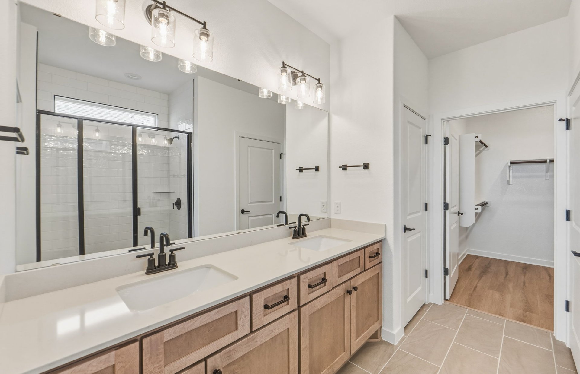 207 Smokestack Lane Georgetown, TX 78633 - Photo 7 of 21 a bathroom with a sink double vanity granite tub shower and a mirror