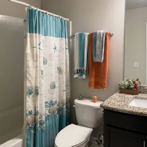 a bathroom with a sink and toilet