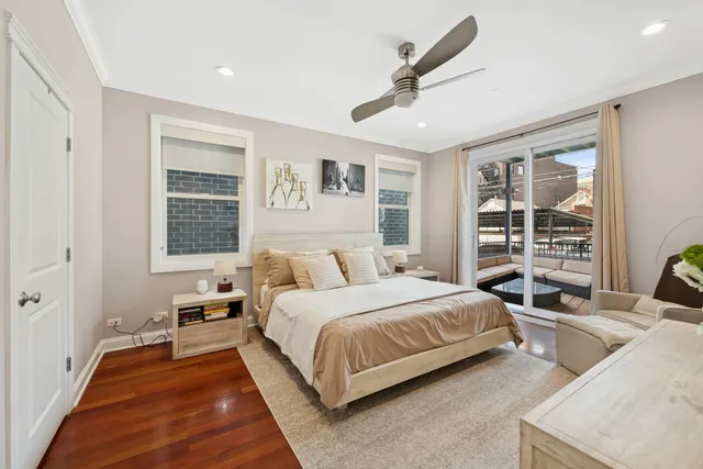 a bedroom with a large bed and a large window