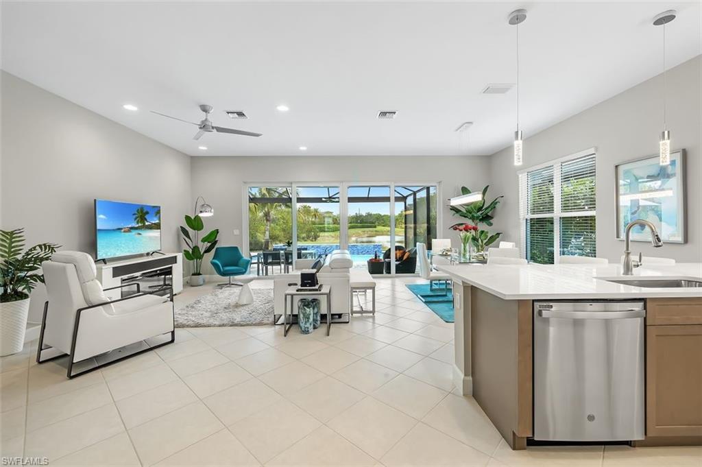 11311 Jacaranda Drive Naples, FL 34120 - Photo 11 of 50 a view of kitchen with furniture and living room