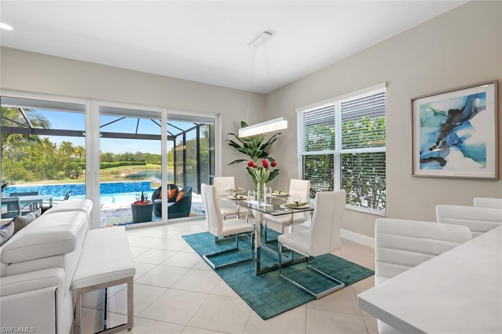 11311 Jacaranda Drive Naples, FL 34120 - Photo 18 of 50 a living room with fireplace furniture and a large window