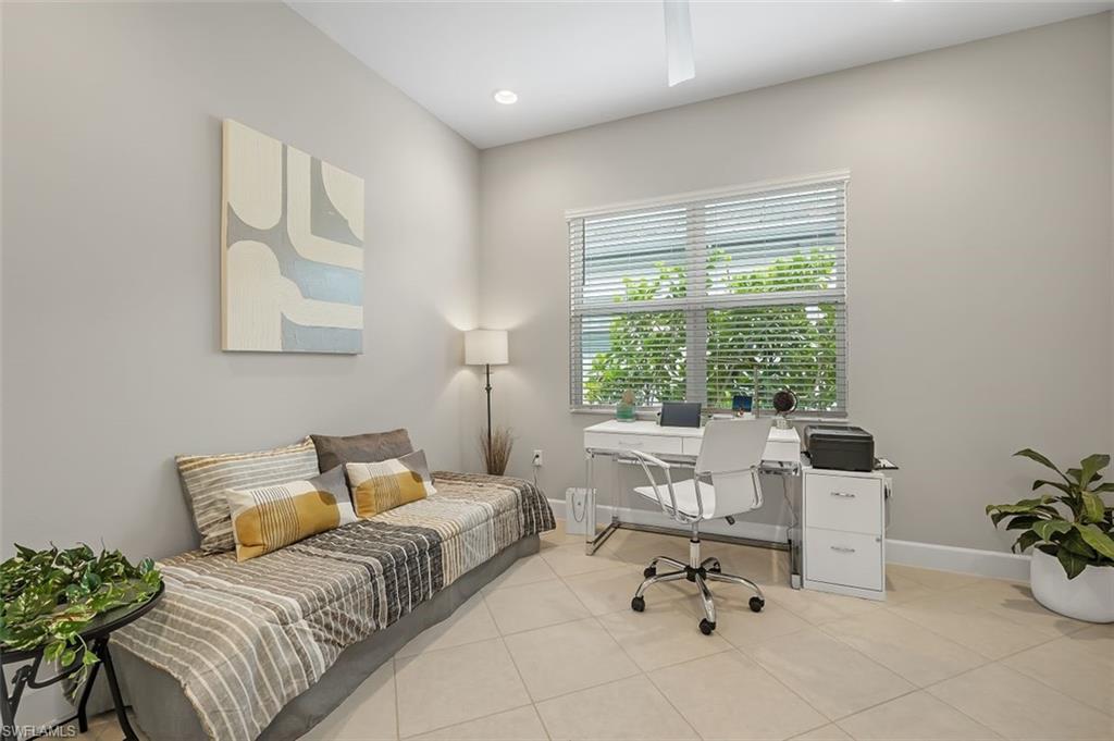 11311 Jacaranda Drive Naples, FL 34120 - Photo 28 of 50 a bedroom with a bed and a couch