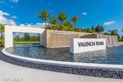 11311 Jacaranda Drive Naples, FL 34120 - Photo 4 of 50 a view of a street with a building in the background