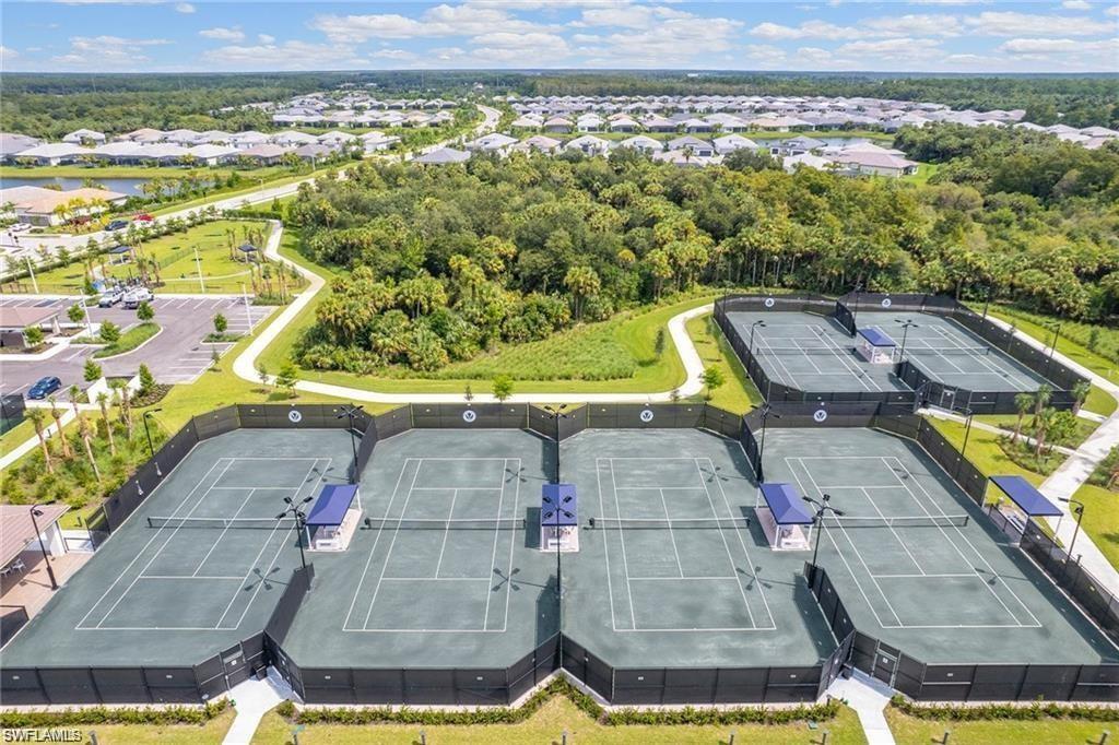 11311 Jacaranda Drive Naples, FL 34120 - Photo 43 of 50 a view of a swimming pool with a yard
