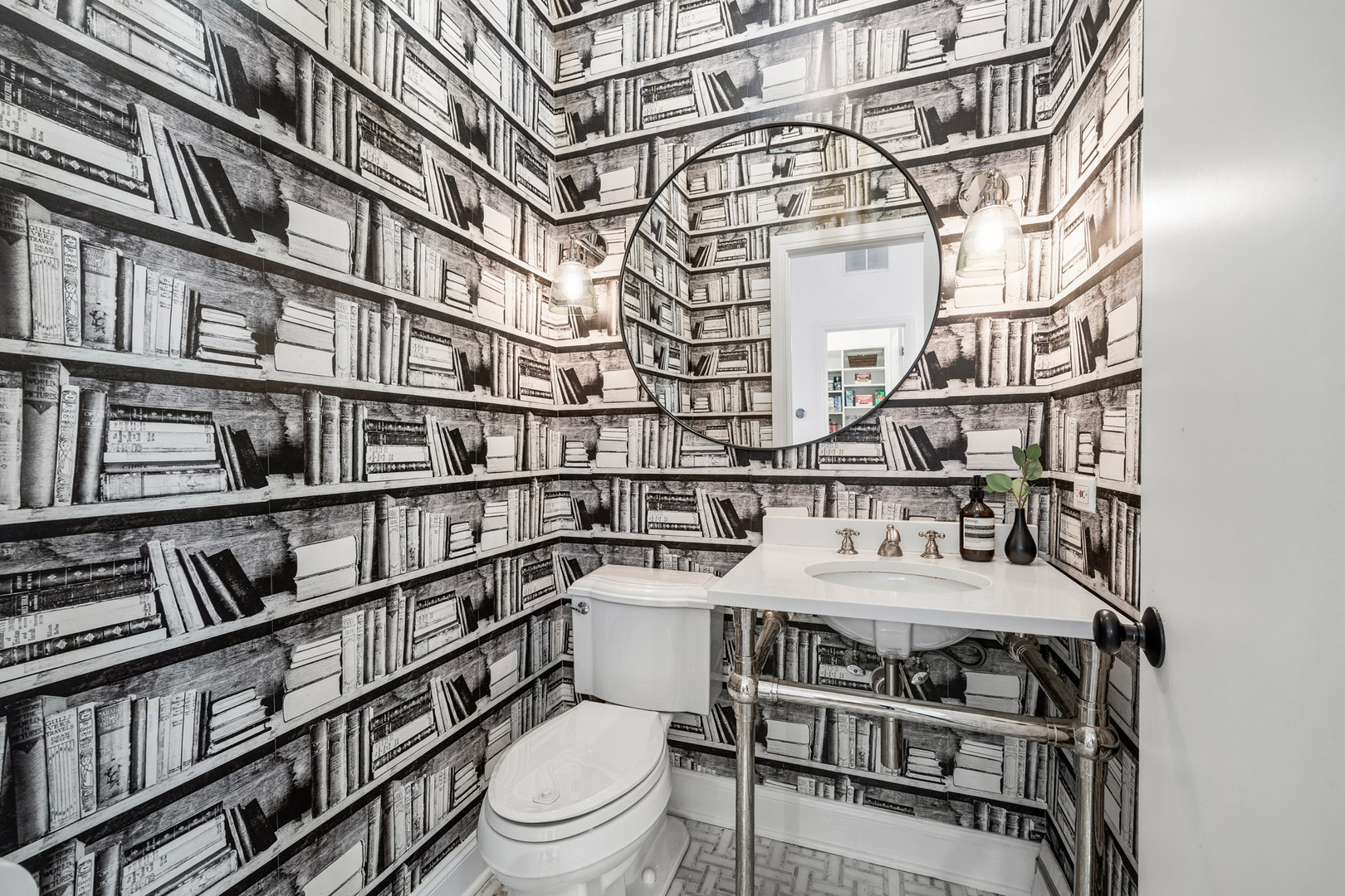 438 East North Water Street Chicago, IL 60611 - Photo 11 of 42 a bathroom with a sink a toilet and a book shelf