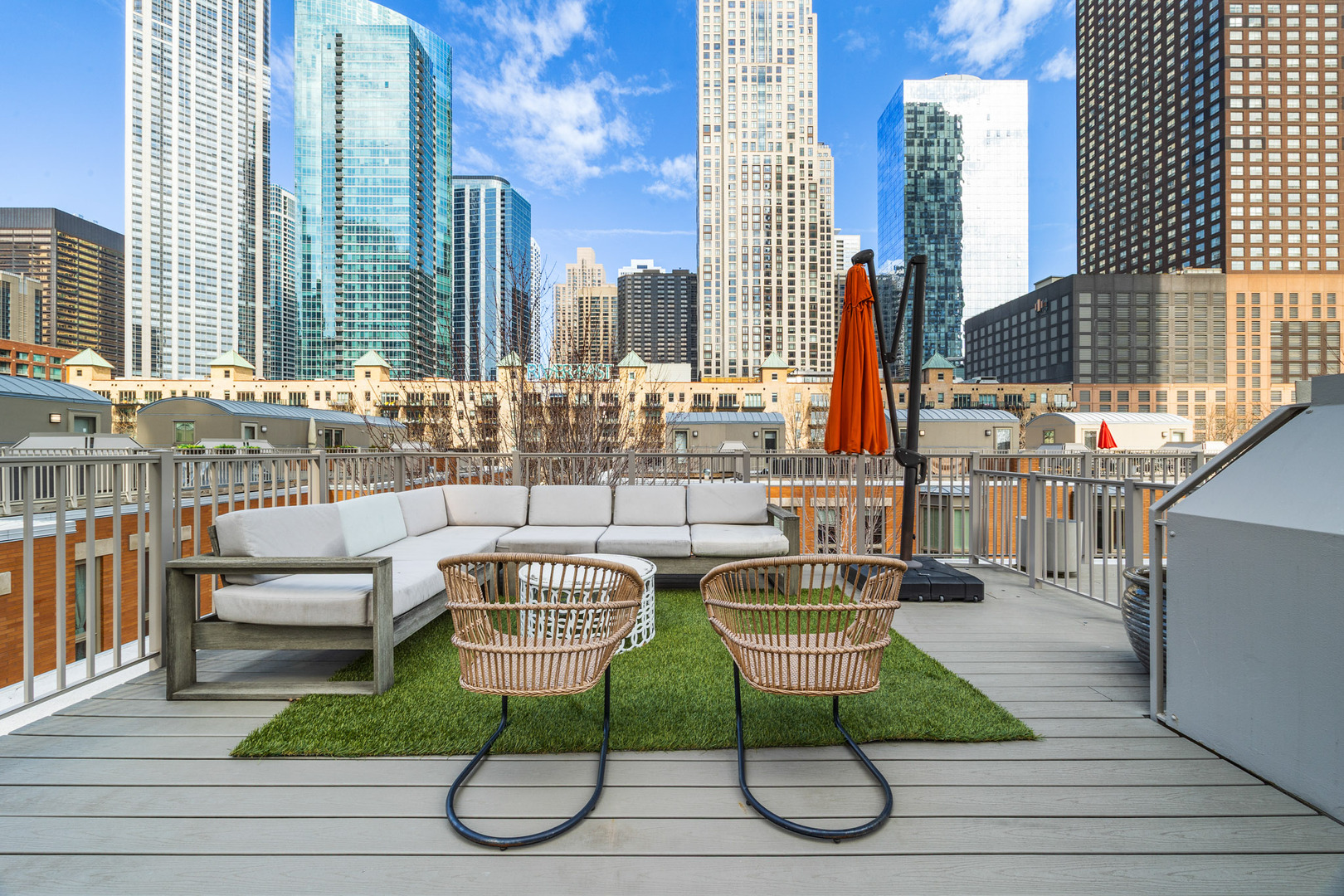 438 East North Water Street Chicago, IL 60611 - Photo 28 of 42 a view of a patio with couches chairs and wooden floor