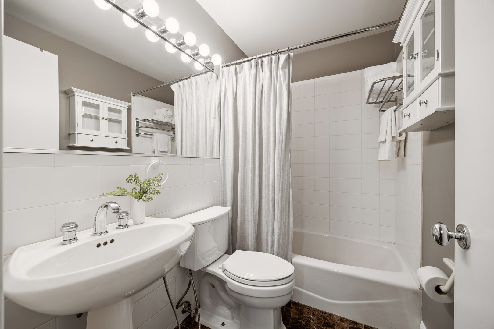 438 East North Water Street Chicago, IL 60611 - Photo 35 of 42 a bathroom with a sink toilet and shower