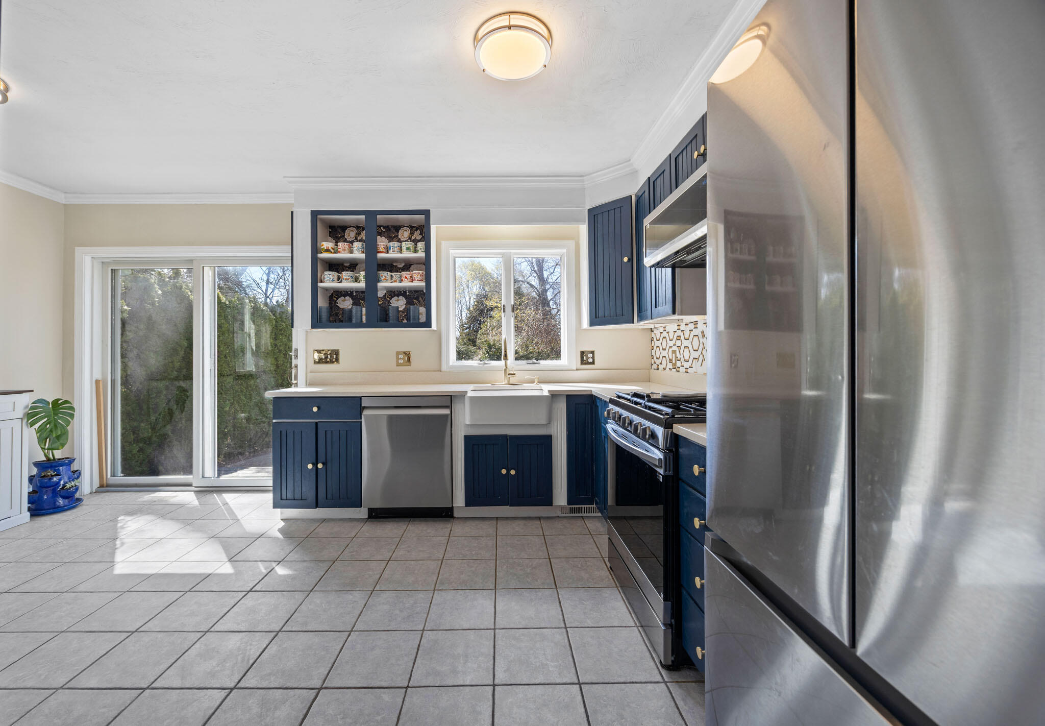 32 Everett Road Buzzards Bay, MA 02532 - Photo 13 of 33 a kitchen with stainless steel appliances a stove a sink and a refrigerator
