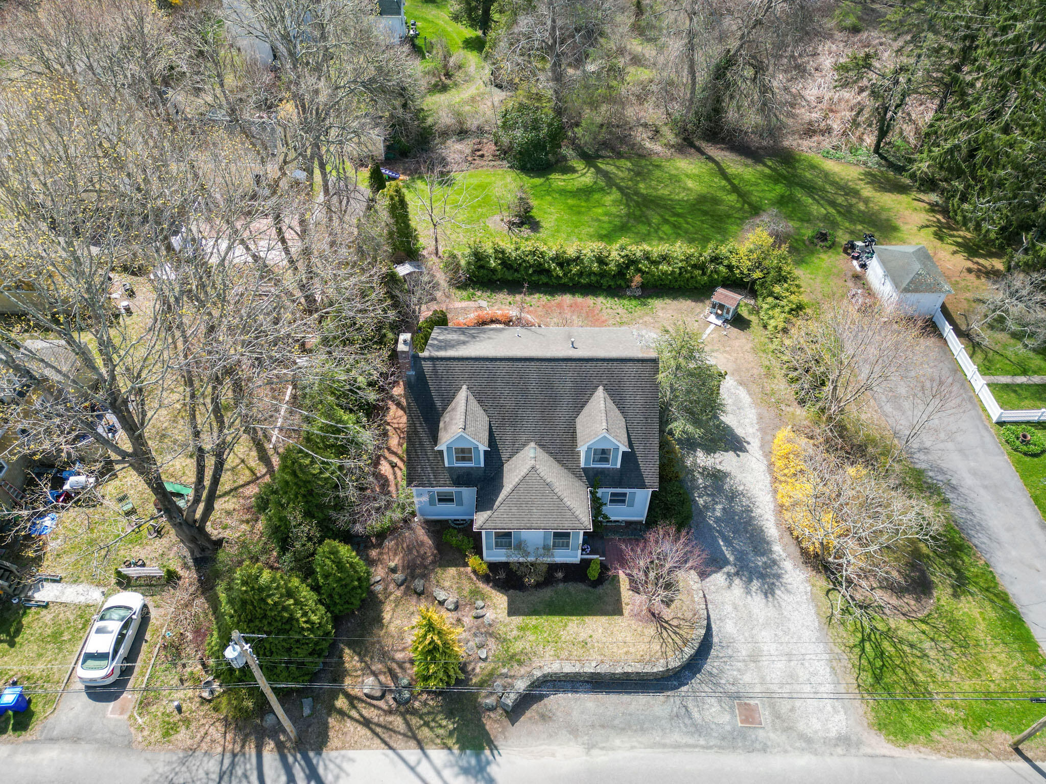 32 Everett Road Buzzards Bay, MA 02532 - Photo 33 of 33 an aerial view of a house with a yard and large trees
