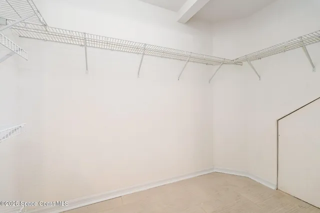 a view of a room with racks on the wall