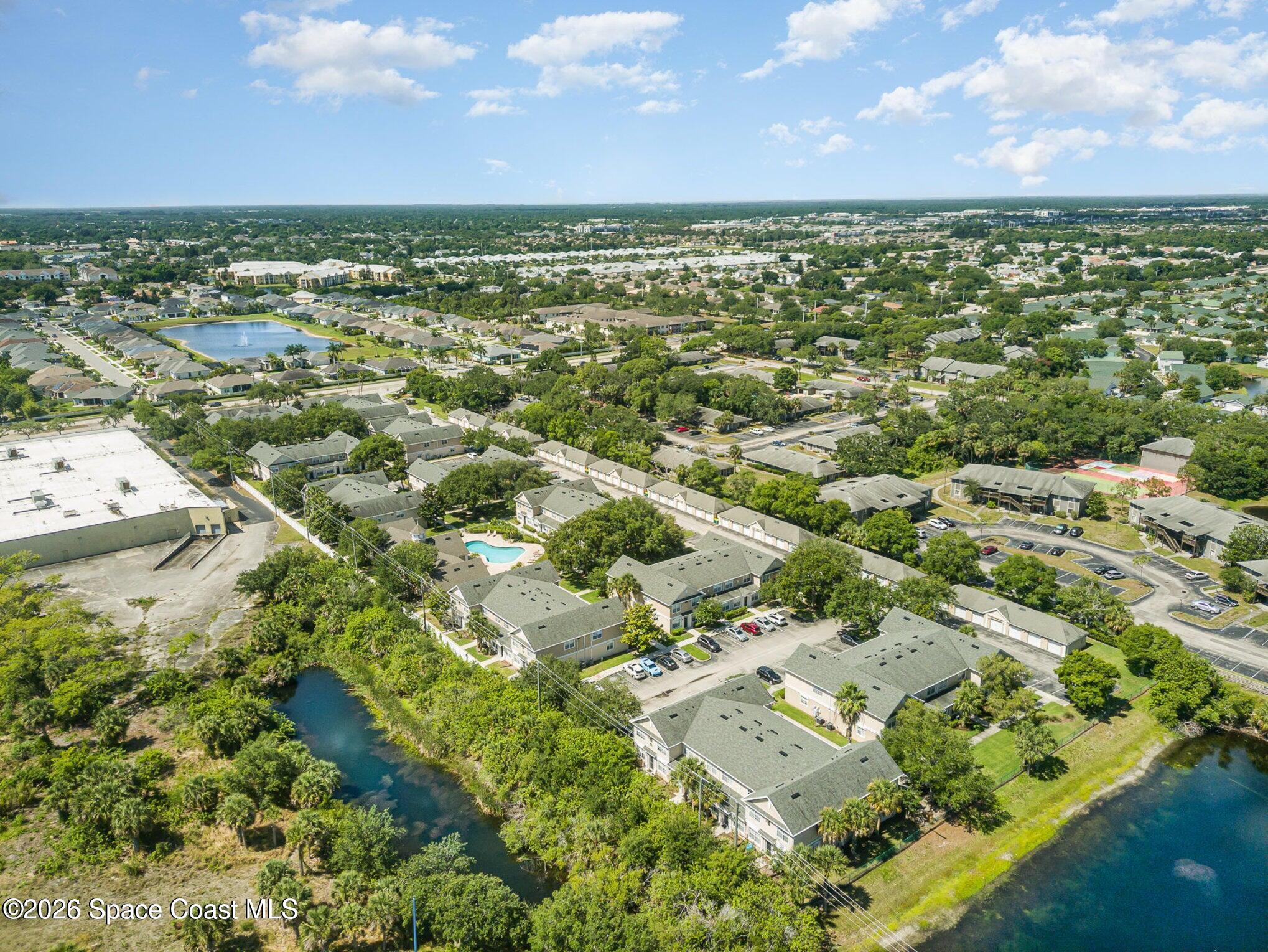 110 Colibri Way, Unit 106 Melbourne, FL 32901 - Photo 26 of 28 an aerial view of residential houses with outdoor space