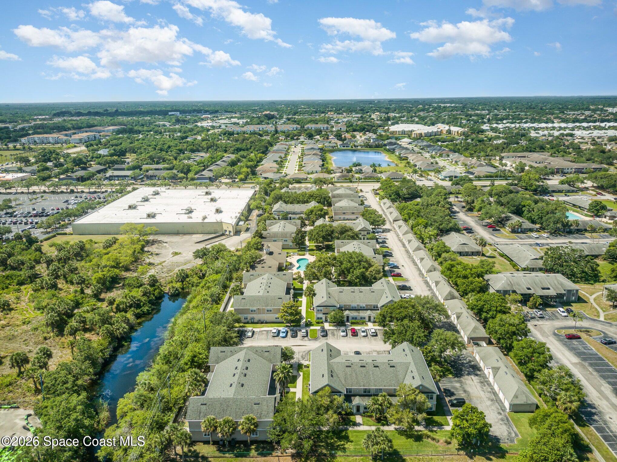 110 Colibri Way, Unit 106 Melbourne, FL 32901 - Photo 27 of 28 an aerial view of residential houses with outdoor space